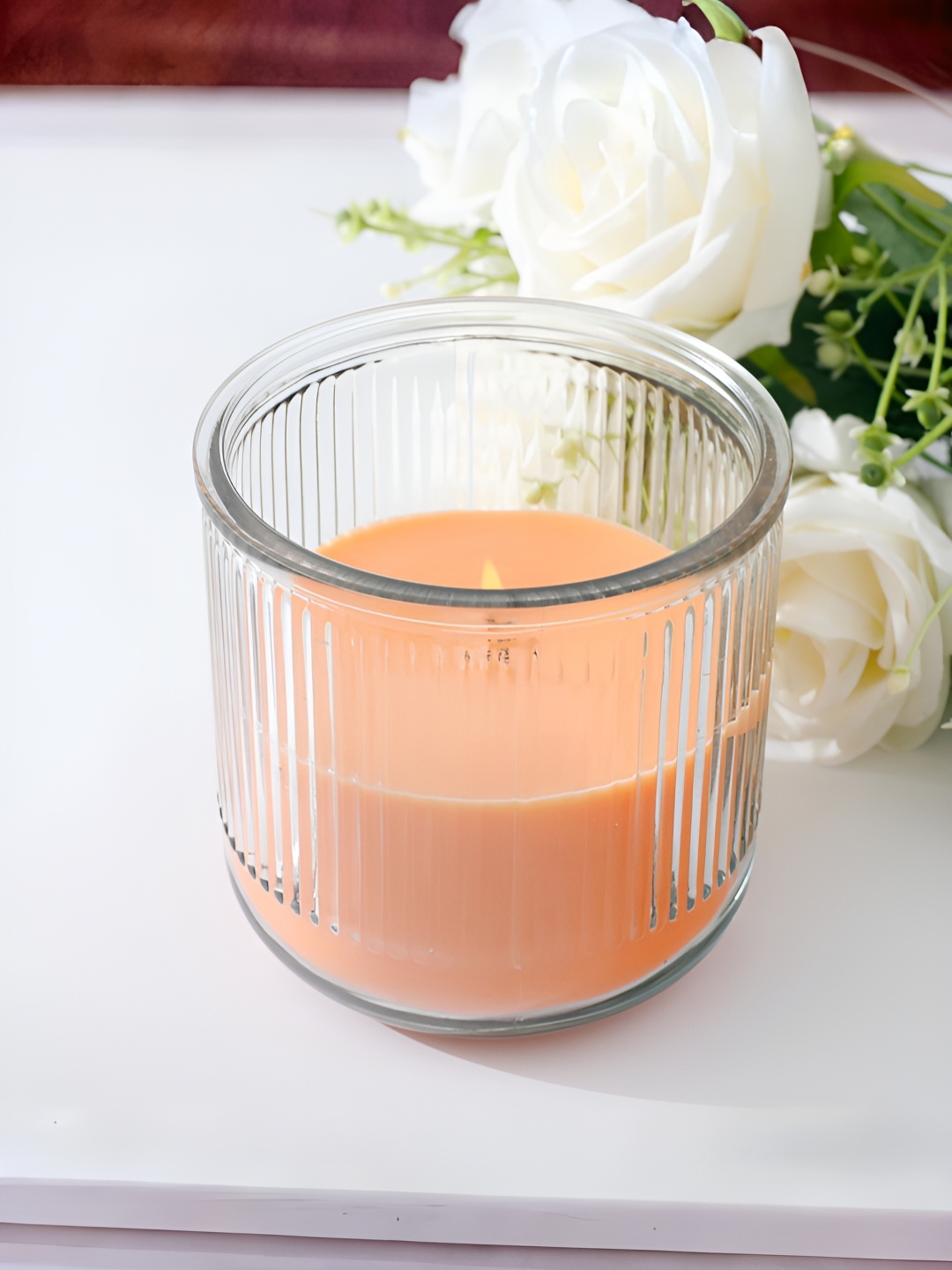 

The Better Home Transparent & Peach Patchouli Scented Candle Jar