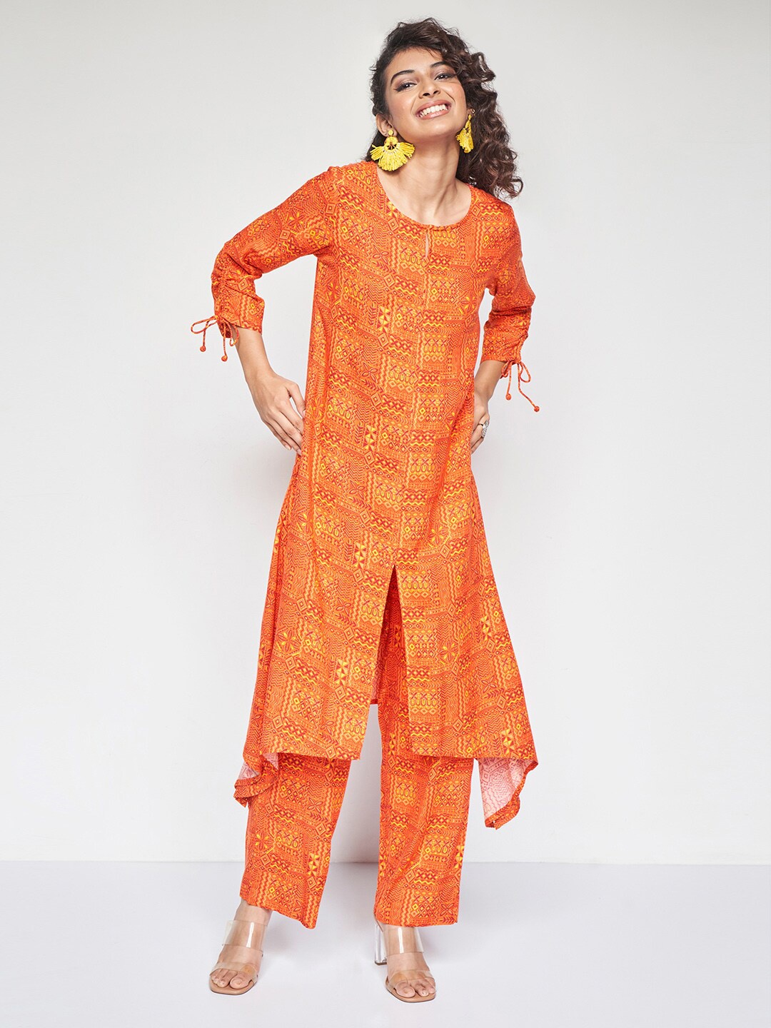 

Global Desi Ethnic Motifs Printed A-Line Kurta With Trousers, Orange