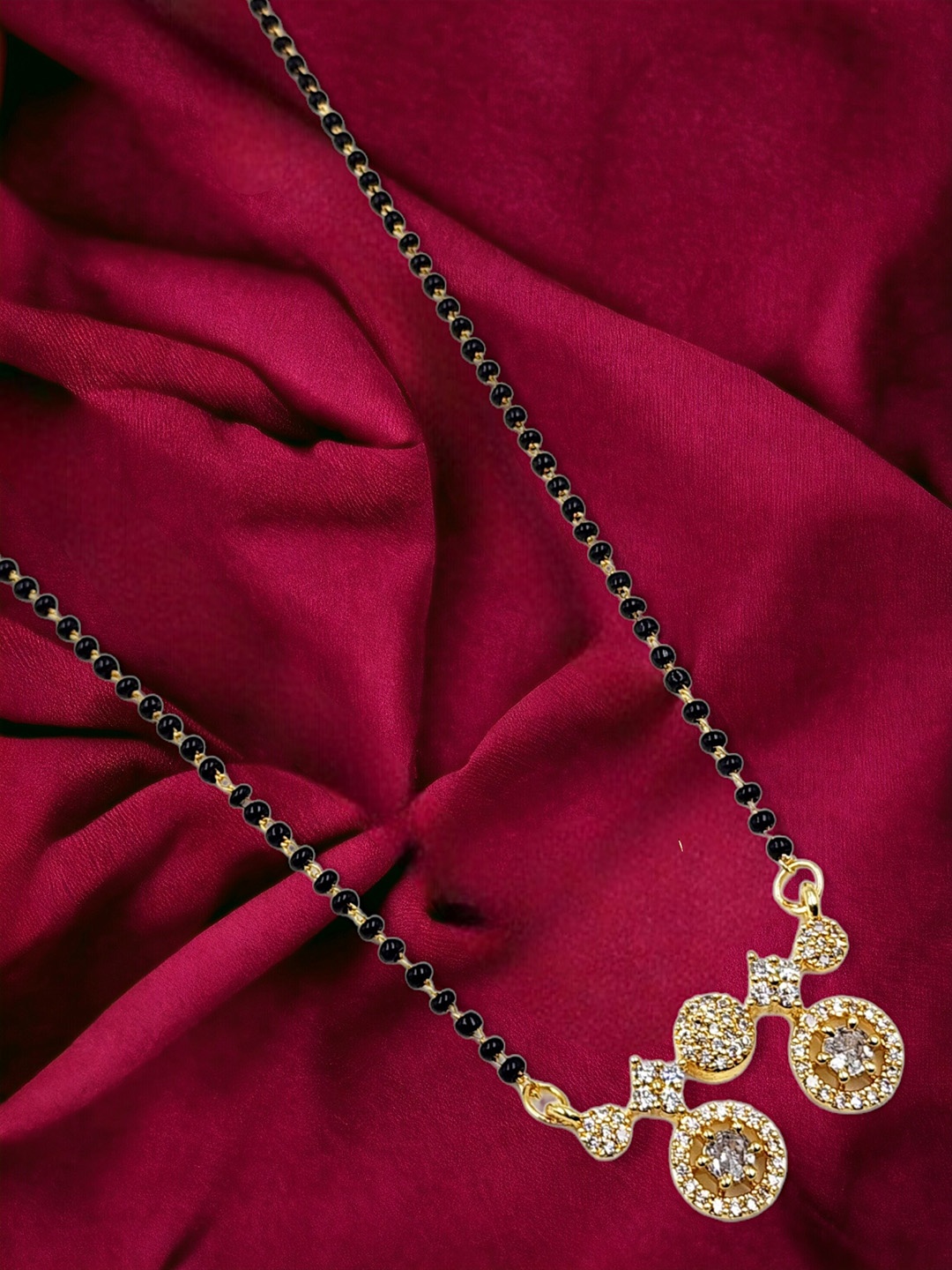 

Anouk Black Gold-Plated AD Stone Studded & Beaded Mangalsutra