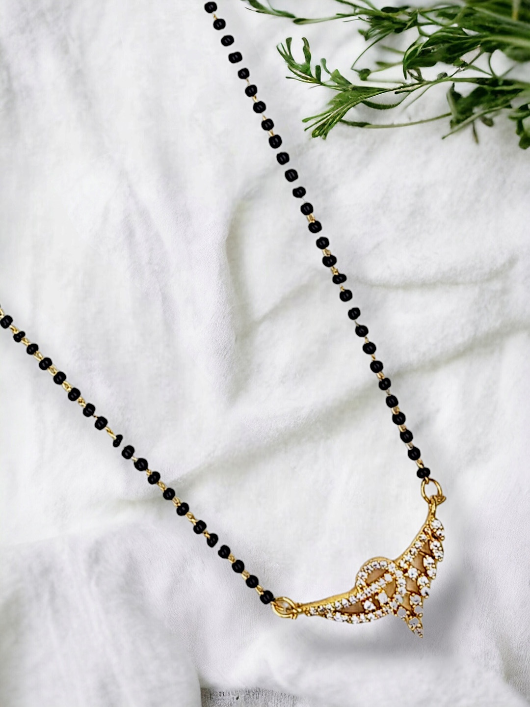 

Anouk Black Gold-Plated AD Stone Studded & Beaded Mangalsutra