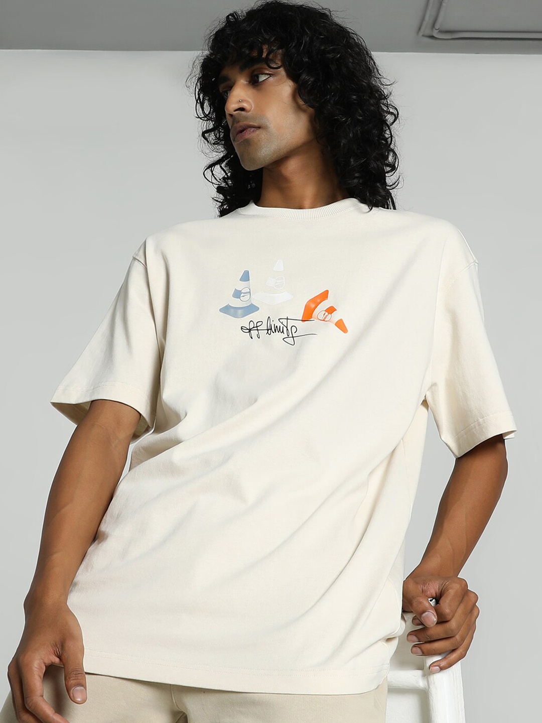 

Puma Unisex DOWNTOWN 180 Graphic Printed Cotton T-shirt, Off white