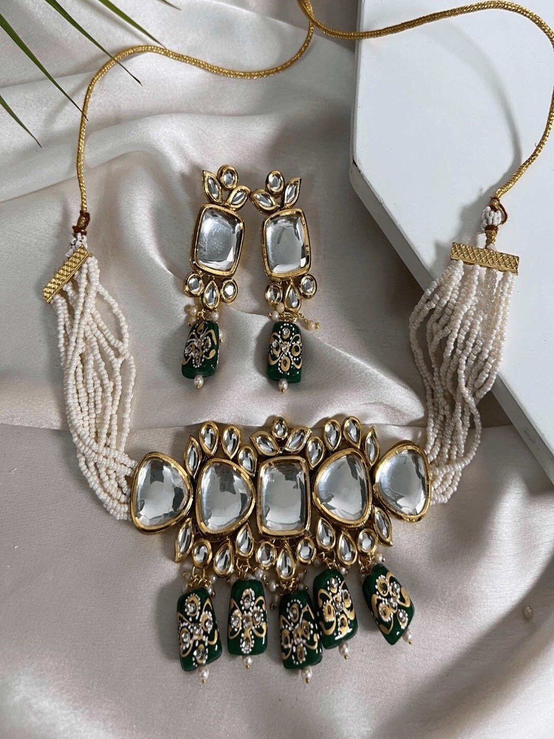 

SwaDev Gold Plated Stones Studded & Beaded Jewellery Set
