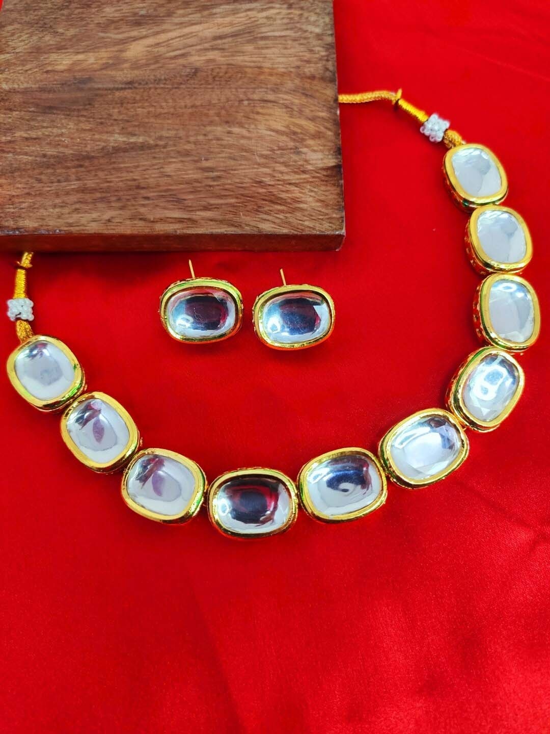 

SwaDev Gold-Plated Kundan Stone Studded Jewellery Set