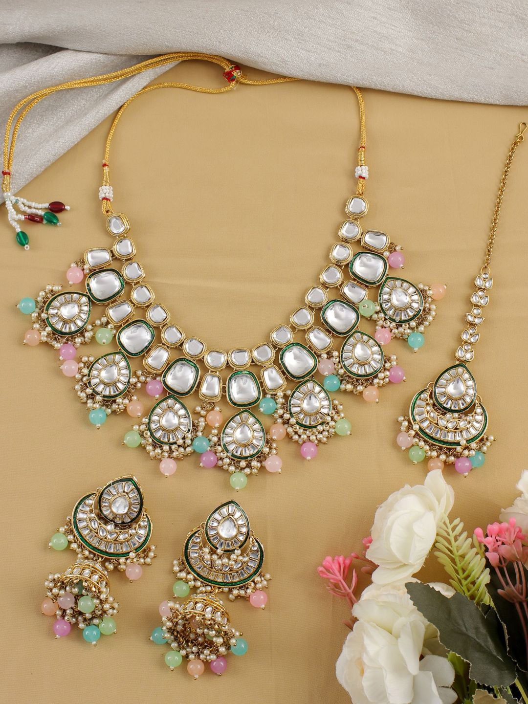 

SwaDev Gold Plated Kundan Studded & Beaded Jewellery Set