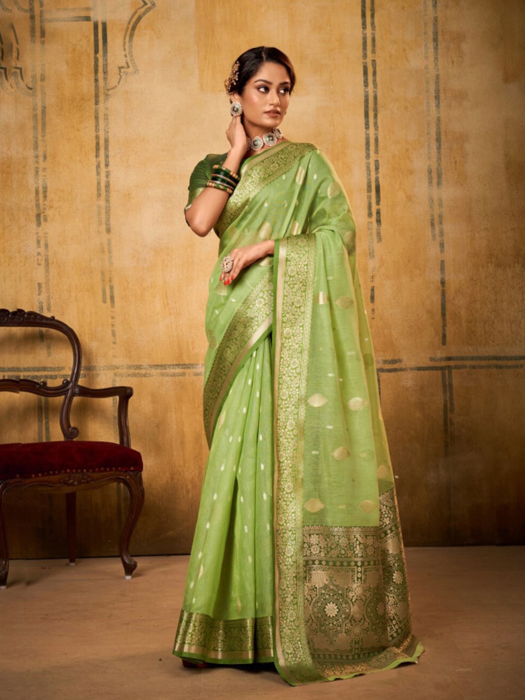 

NK Textiles Ethnic Motifs Woven Design Zari Tissue Saree, Green