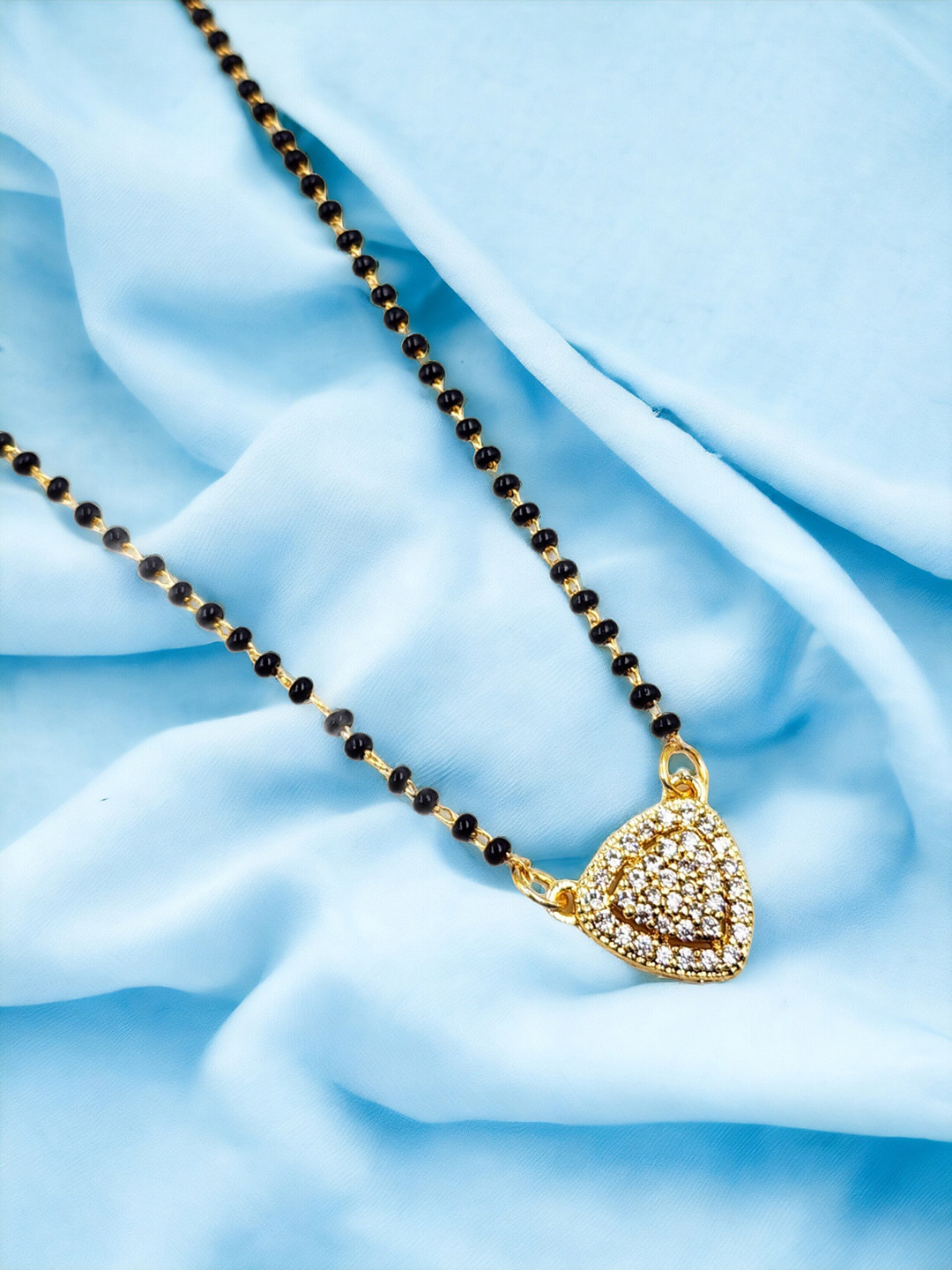 

Anouk Black Gold-Plated AD Stone Studded & Beaded Mangalsutra