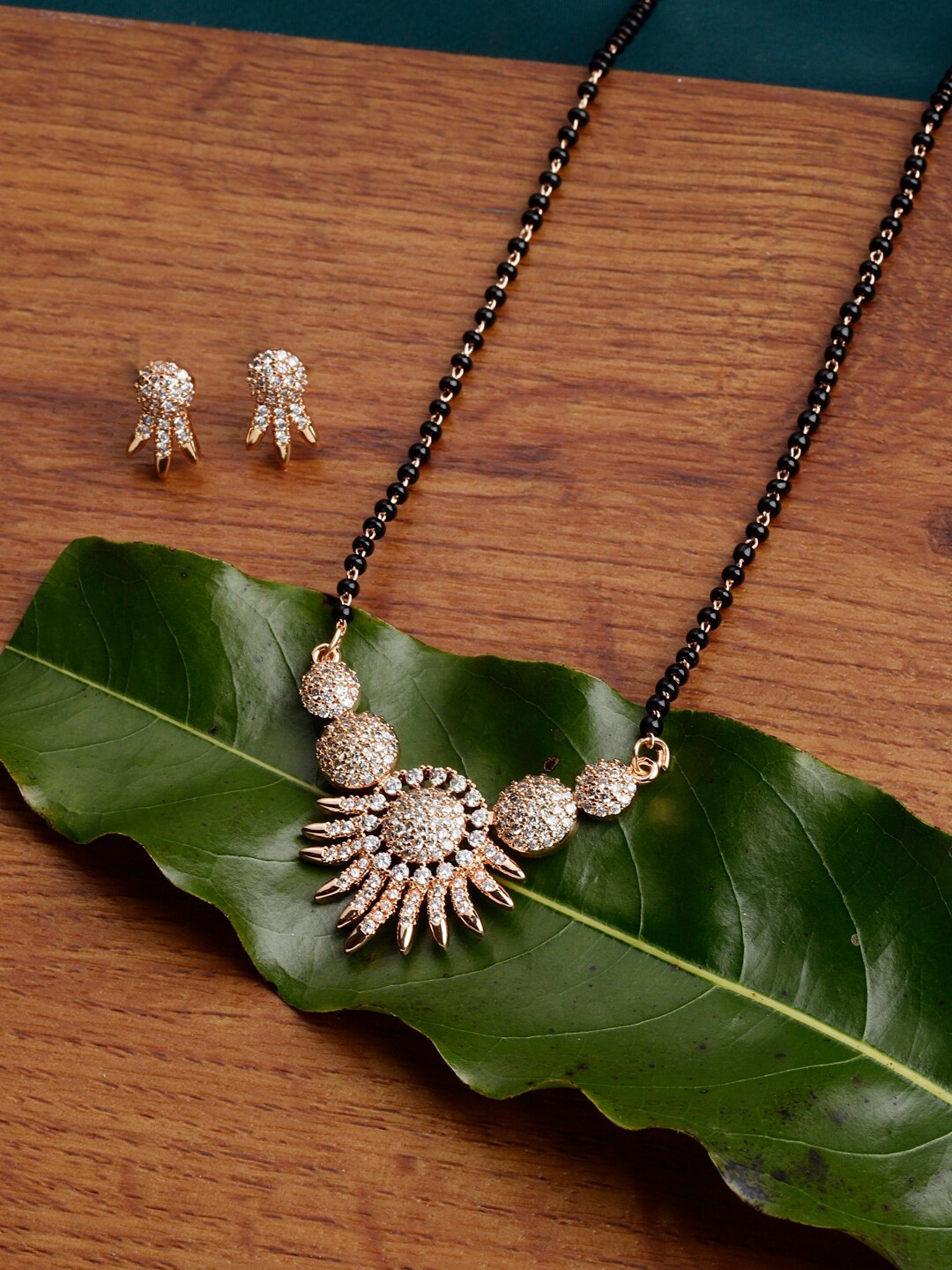 

PANASH Gold-Plated AD Stone-Studded Beaded Mangalsutra With Earrings