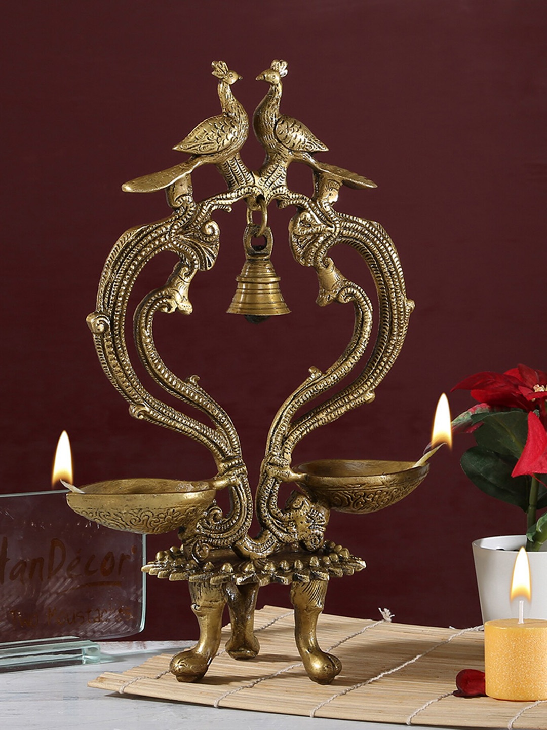 

Two Moustaches Brown Brass Ethnic Carved Peacock Design Over Twin Diya