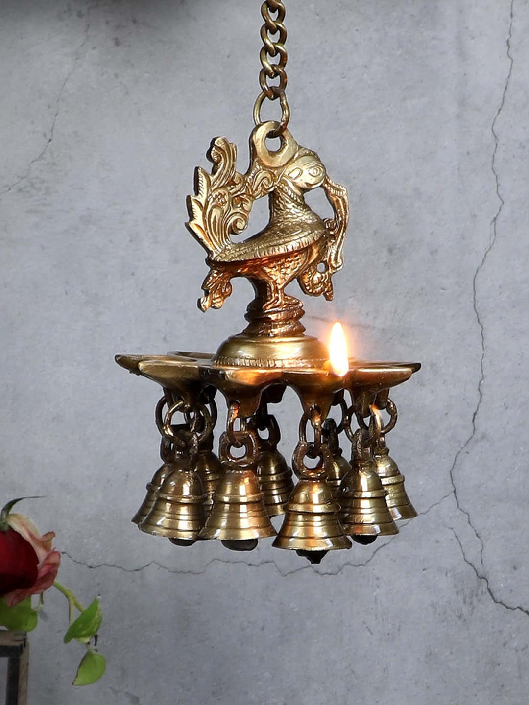 

Two Moustaches Brown Peacock Design Brass Hanging Diya with Bells