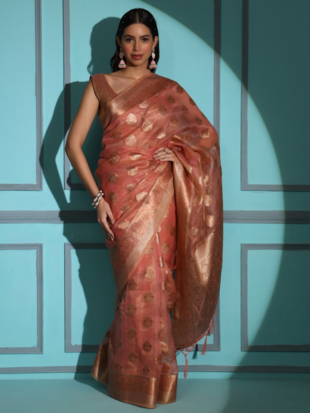 

Tikhi Imli Peach Ethnic Motifs Woven Design Zari Organza Saree