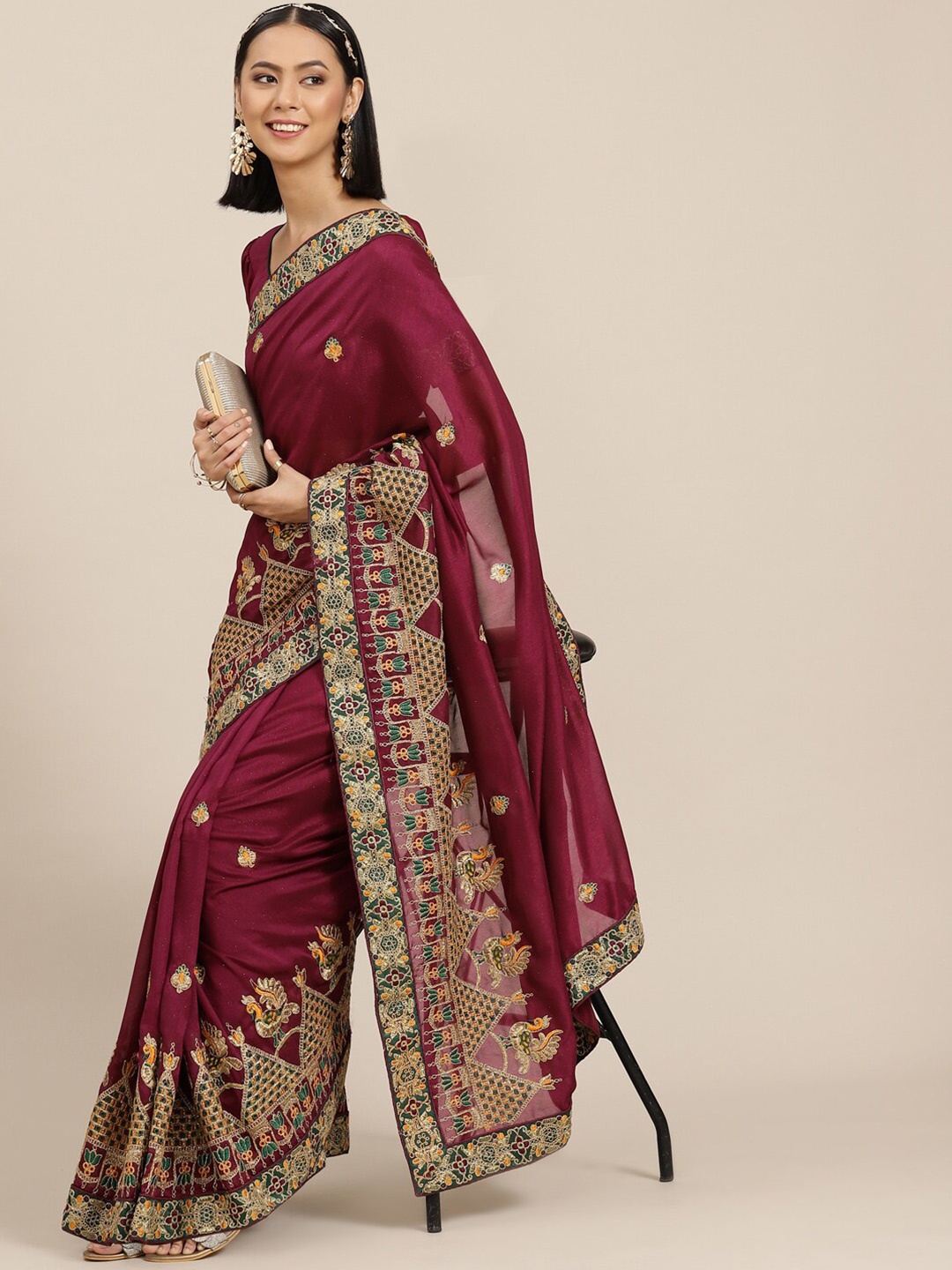 

Mitera Purple Ethnic Motifs Embroidered Zari Saree