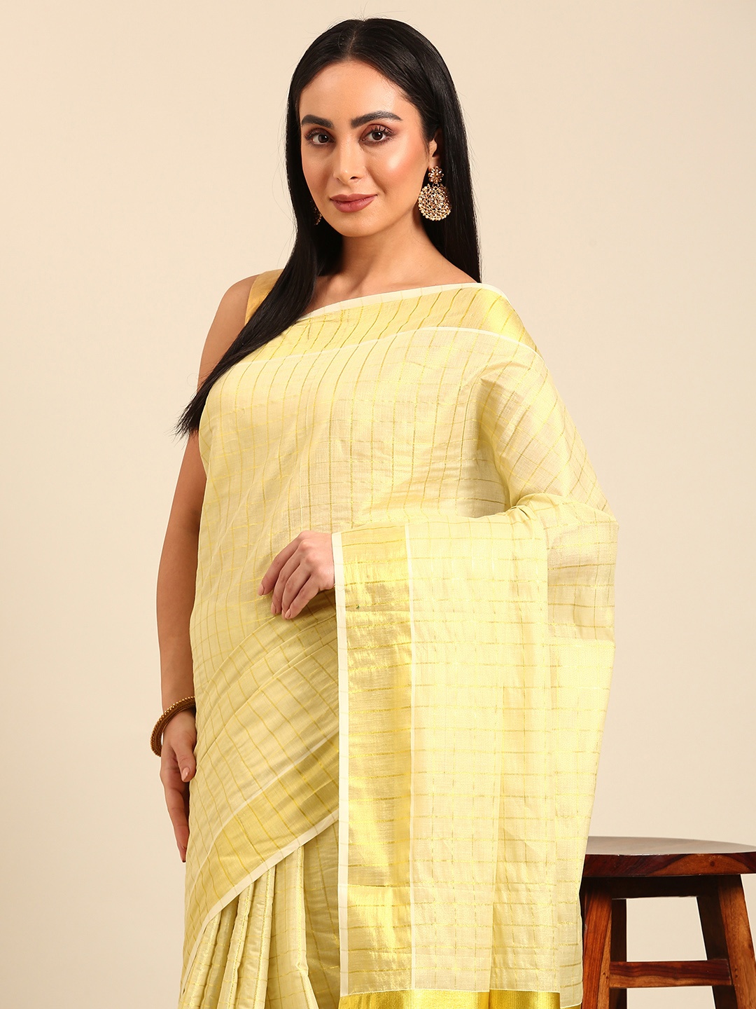 

Kalyan Silks Checked Tissue Kasavu Saree, Yellow