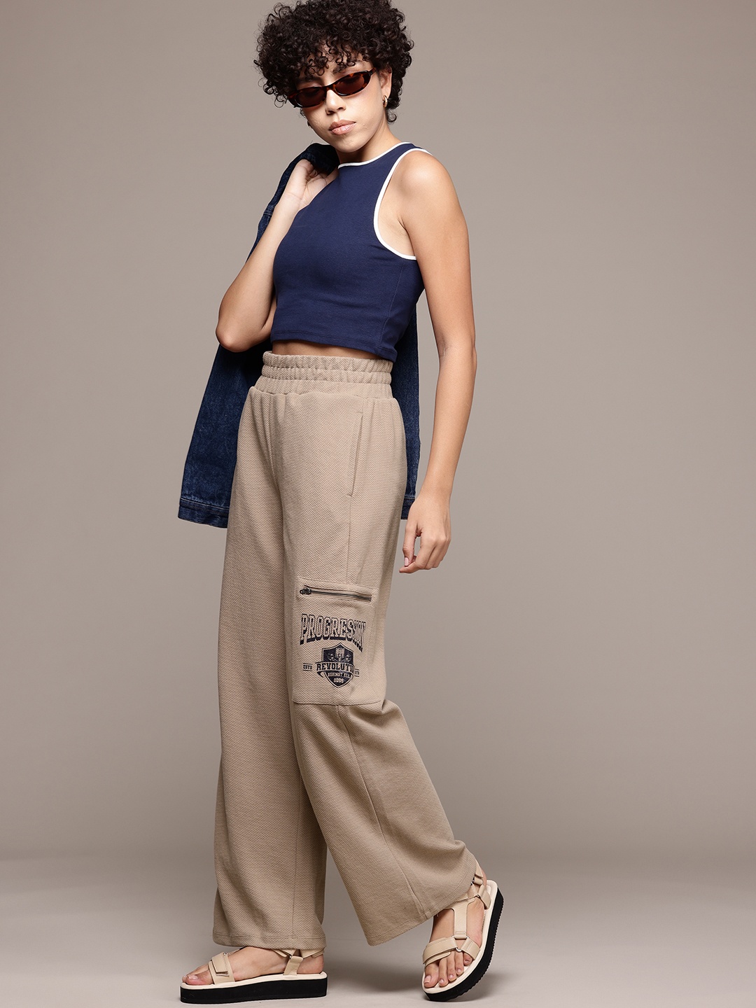 

The Roadster Lifestyle Co. Women Flared Trousers, Beige
