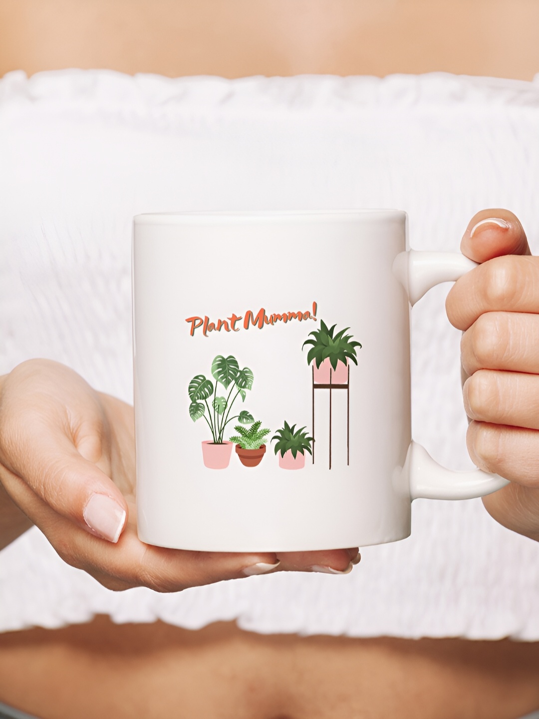 

The Decor Lane White & Green Printed Ceramic Glossy Mug 325 ml