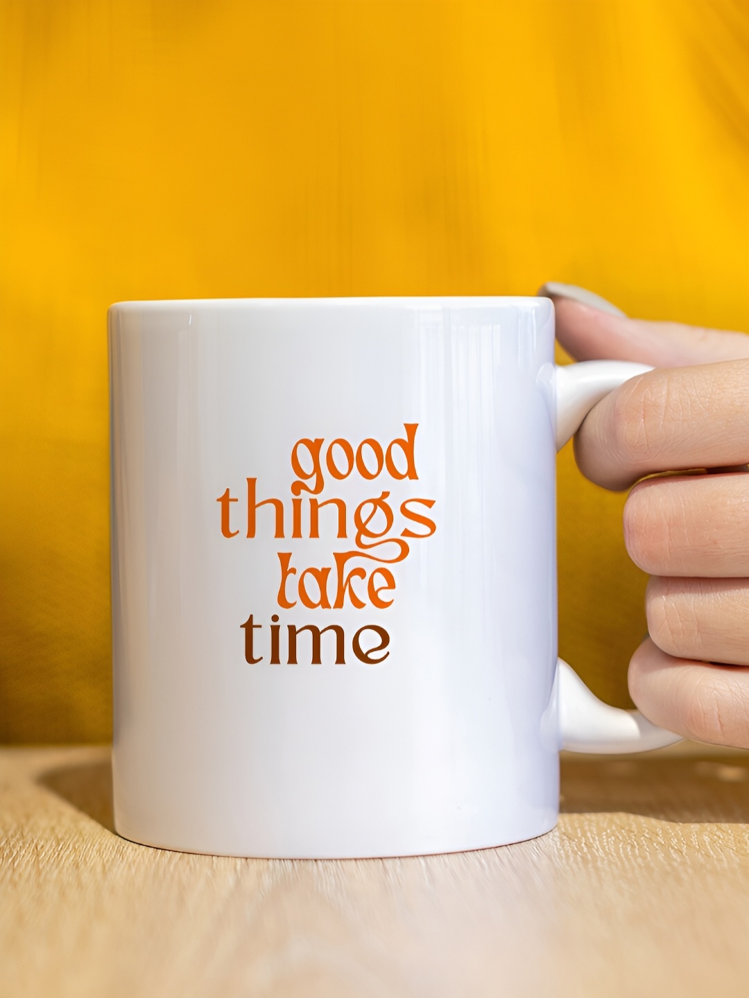 

The Decor Lane White & Orange Printed Ceramic Glossy Mug 325 ml