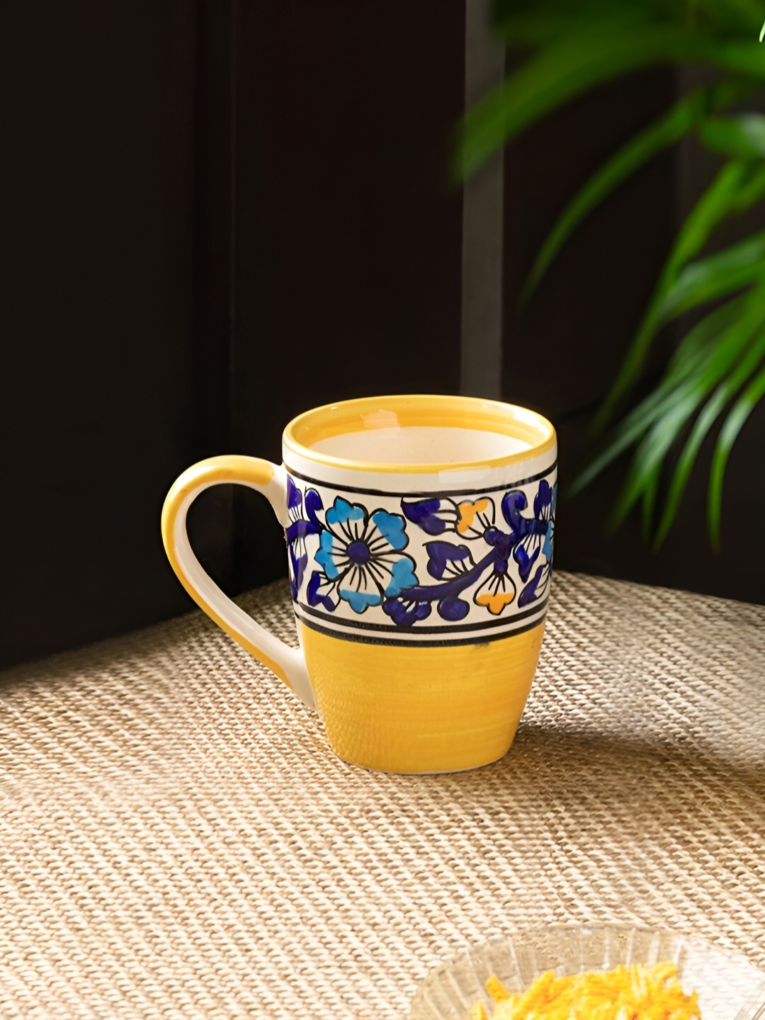 

ExclusiveLane Yellow & Blue Floral Printed Ceramic Glossy Tea & Coffee Mug 240 Ml