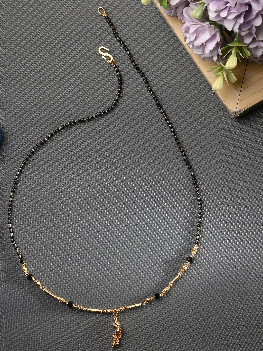 

AanyaCentric Gold-Plated AD-Studded Mangalsutra, Earring & Ring Set