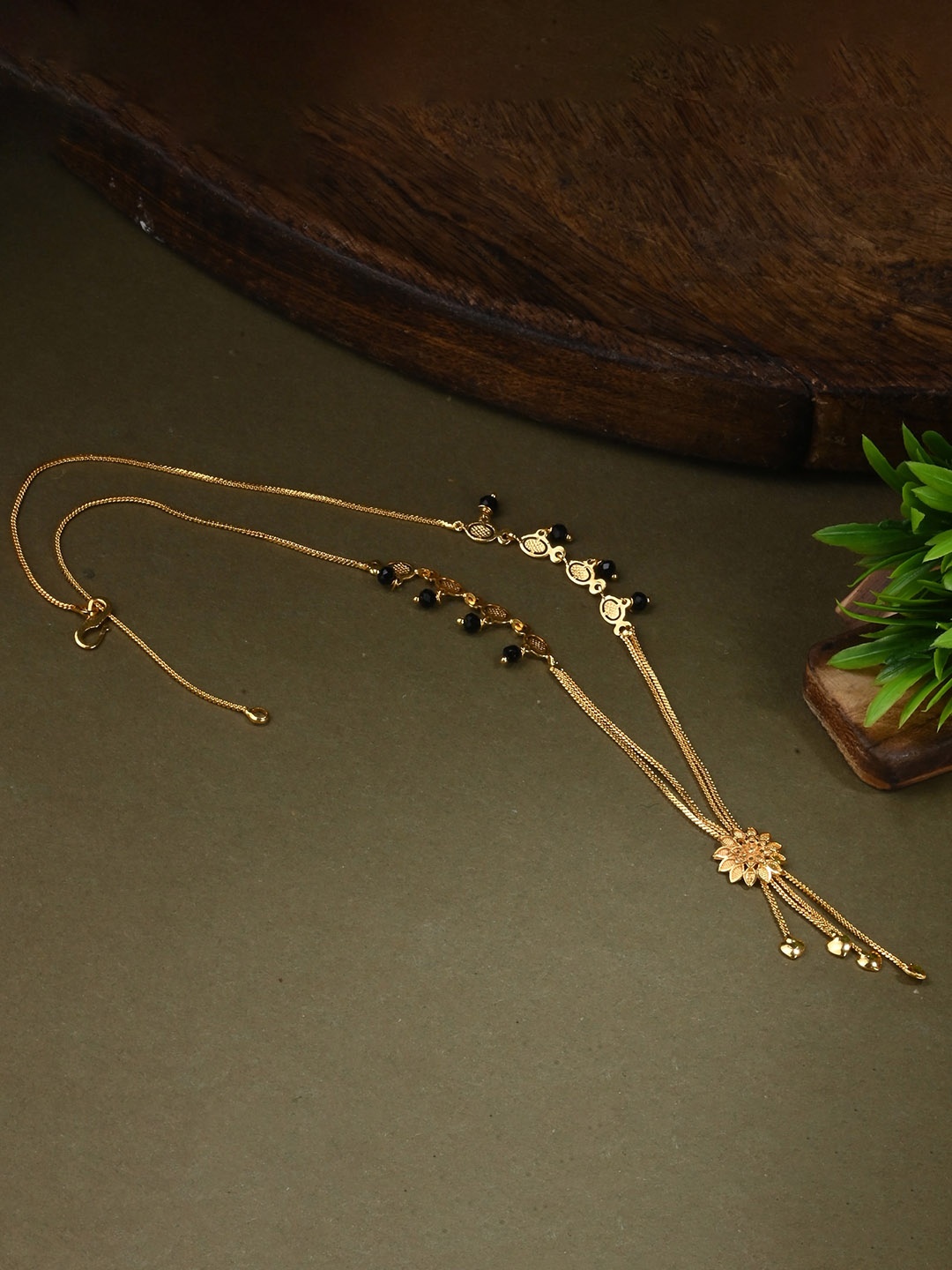 

AanyaCentric Gold-Plated AD-Studded Mangalsutra, Earring & Ring Set