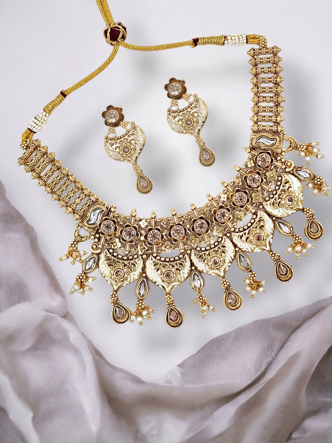 

Anouk Gold Plated Stones Studded & Beaded Jewellery Set