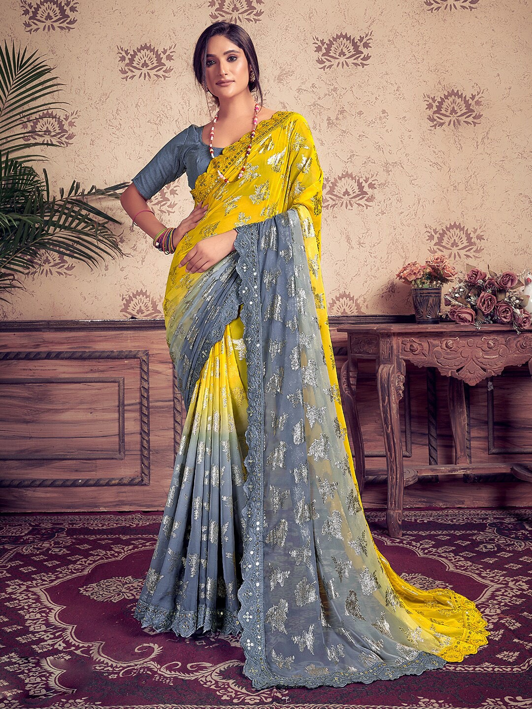 

SANSKAR Ethnic Motifs Printed Embroidered Sequinned Pure Georgette Saree, Yellow