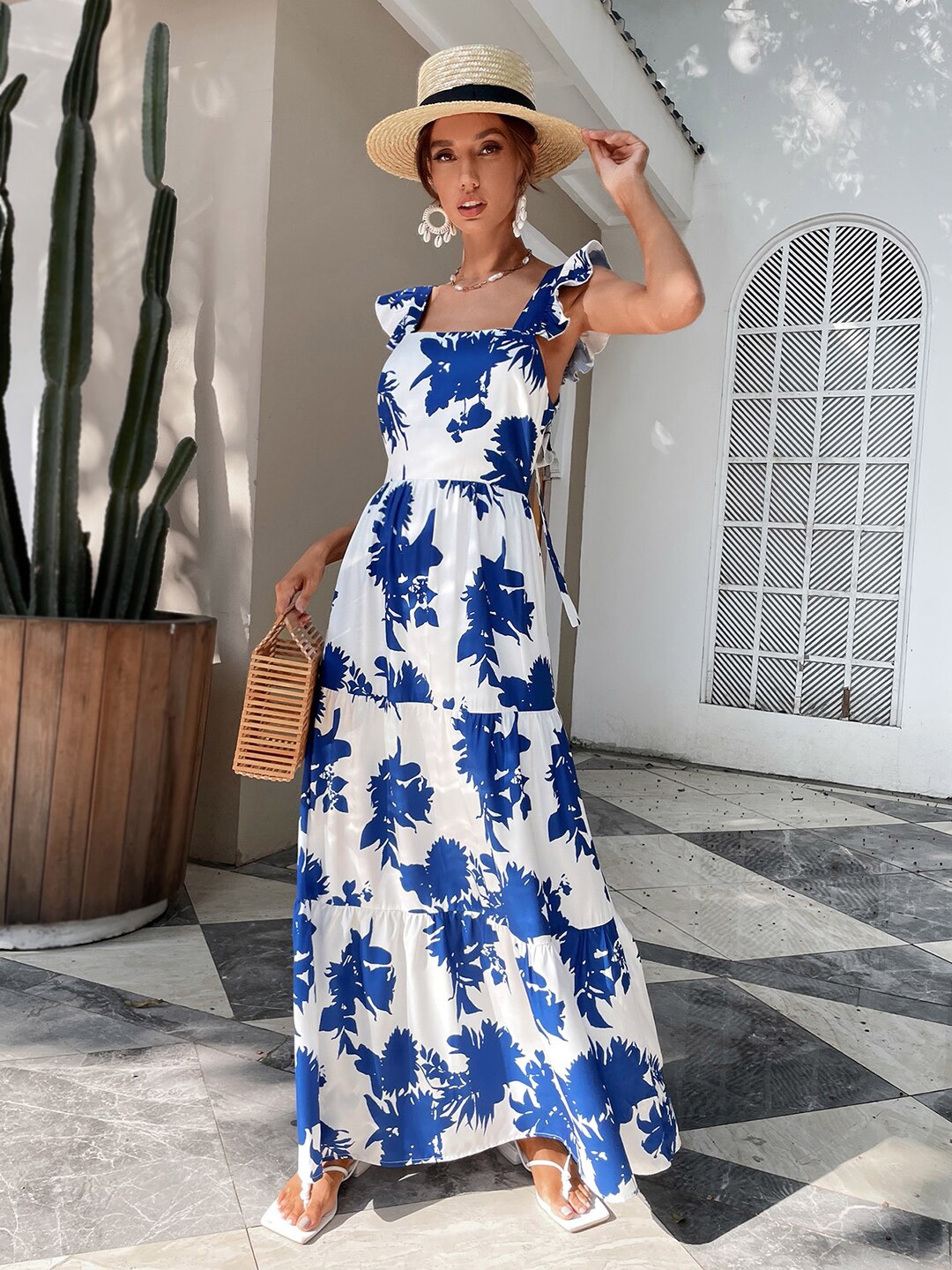 

Stylecast X Kotty Women Flutter Sleeves Backless Floral Maxi Dress, White