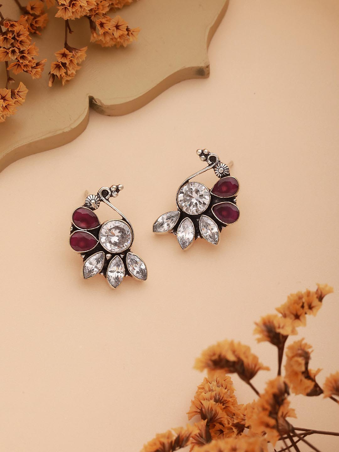 

Saraf RS Jewellery Rhodium-Plated American Diamond Studded Contemporary Studs Earrings, Silver