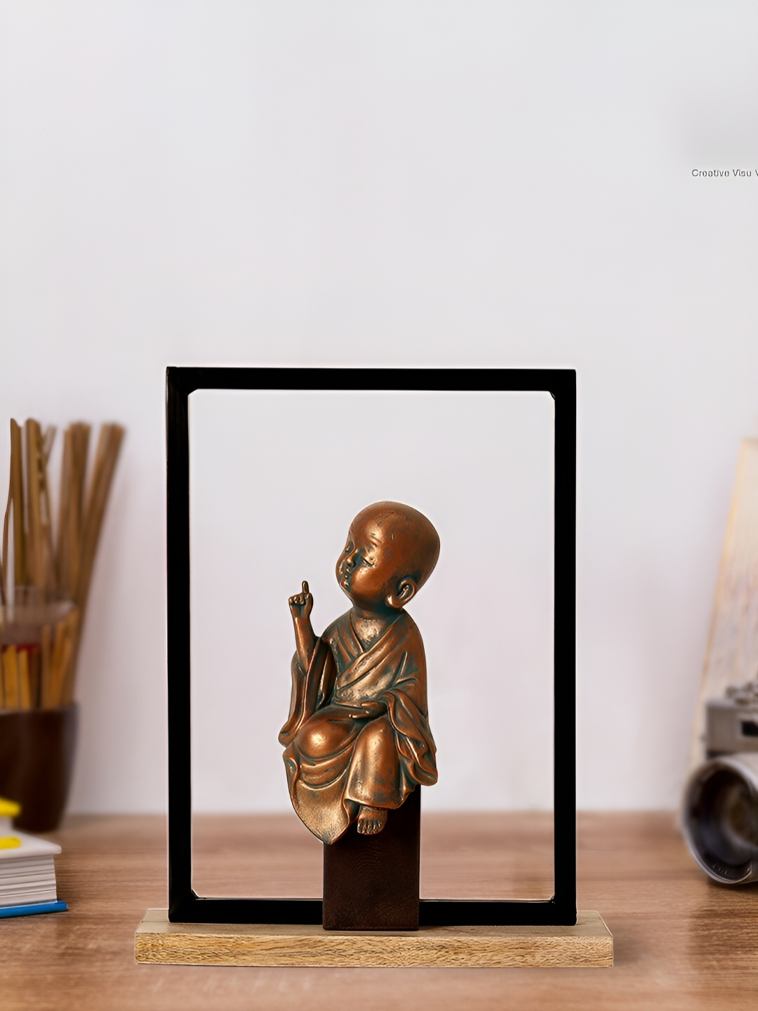 

CASA DECOR Brown Young Buddha Figurine Showpiece