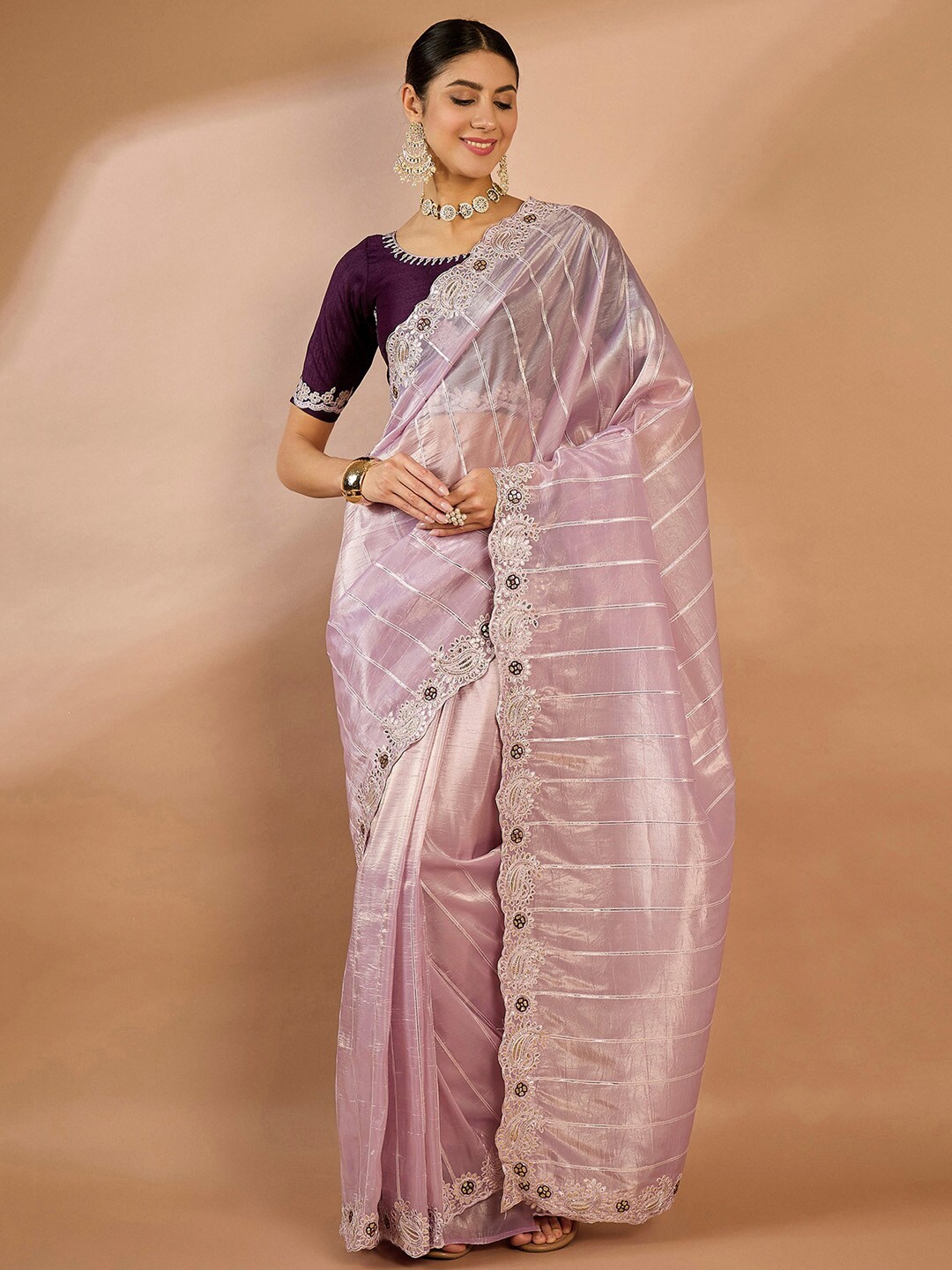 

Saree mall Ethnic Motifs Embroidered Zari Saree, Purple