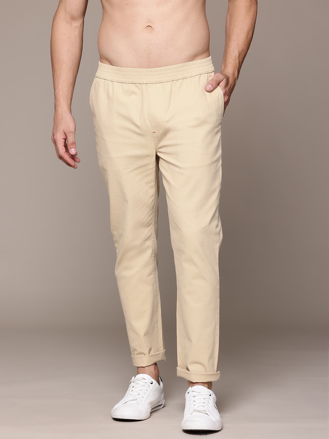 

The Roadster Lifestyle Co. Men Solid Trousers, Beige