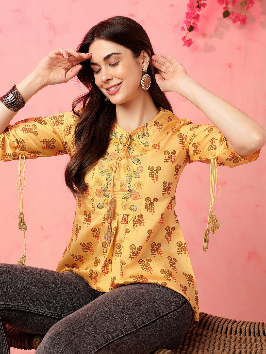 

Anouk Floral Printed Tie-Up Neck Thread Work Thread Work A-Line Short Kurti, Yellow
