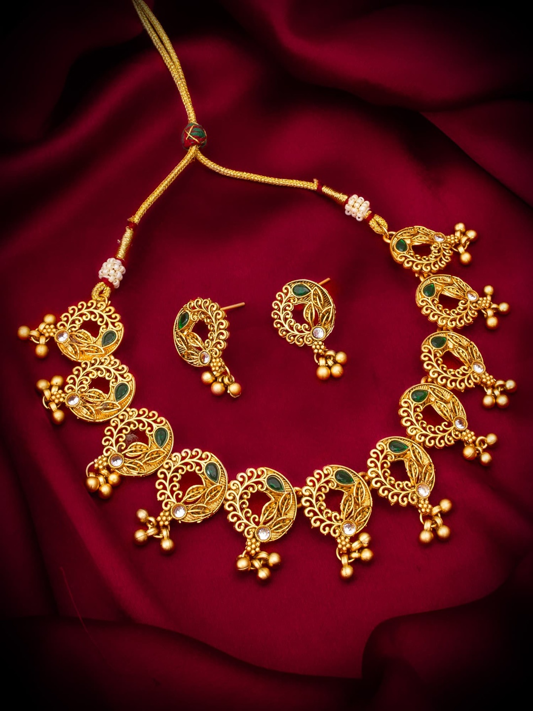 

aadita Gold-Plated Stone-Studded & Beaded Jewellery Set