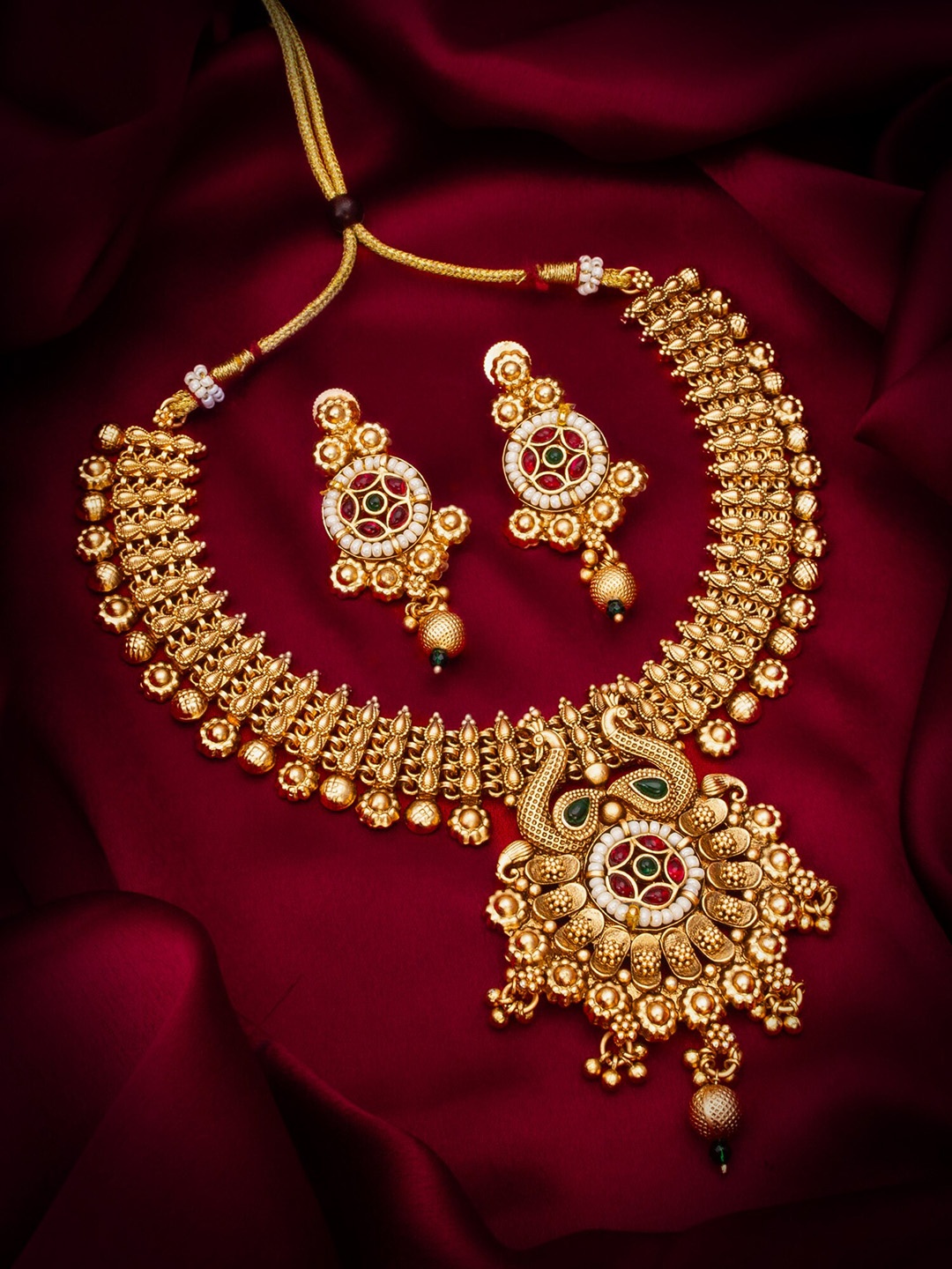 

aadita Gold-Plated Stone-Studded & Beaded Jewellery Set