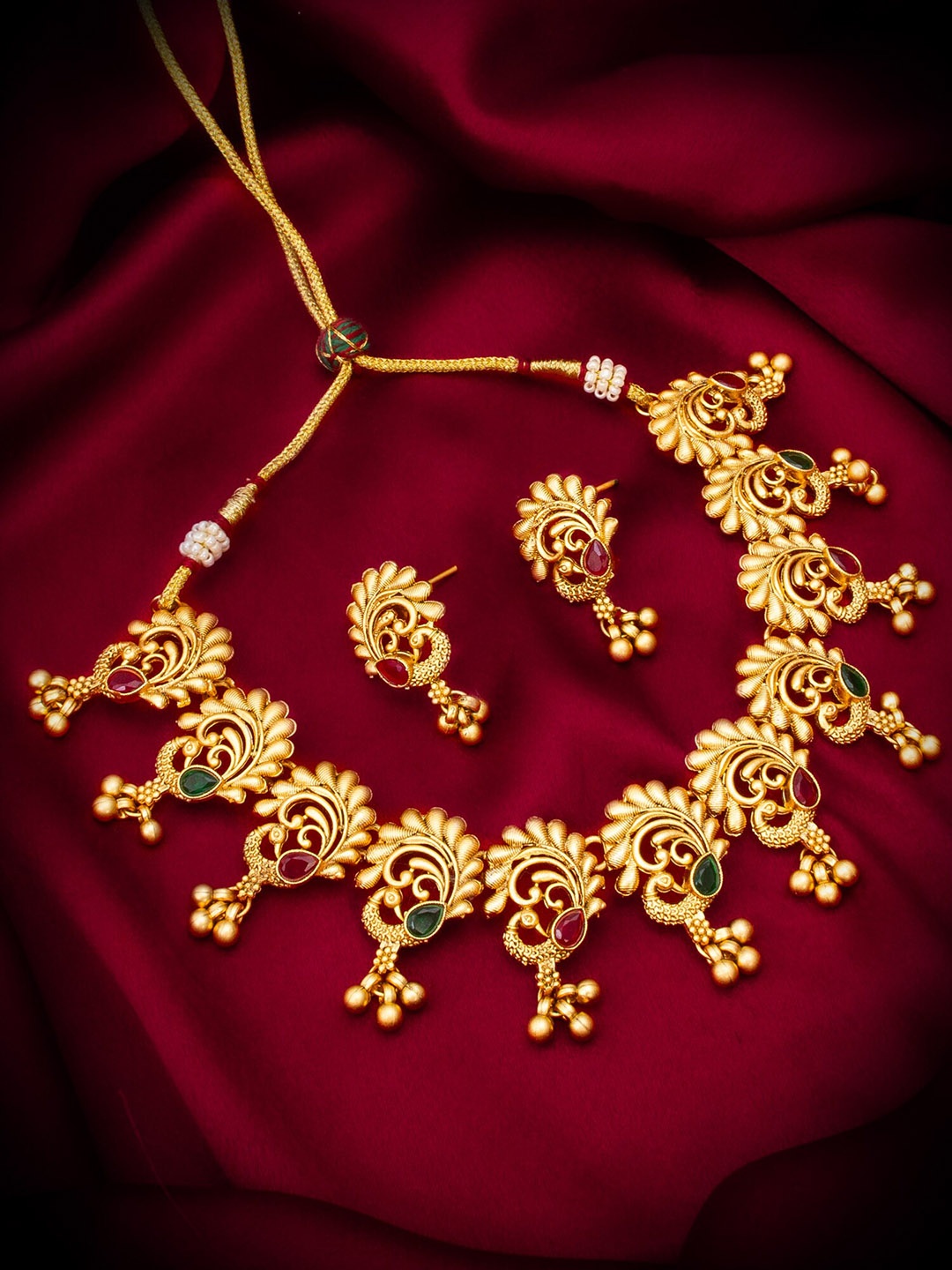 

aadita Gold-Plated Stones Studded Jewellery Set
