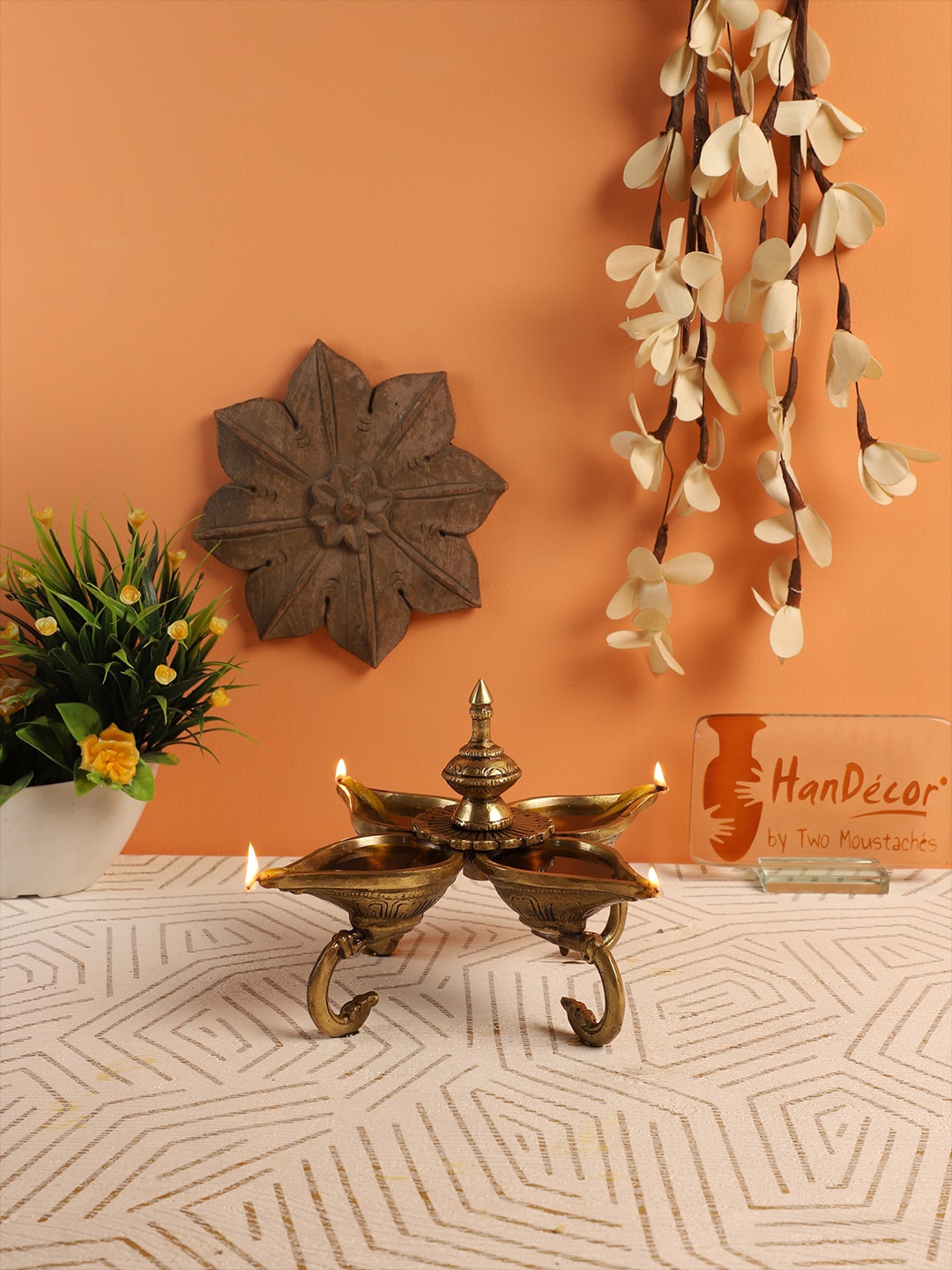 

Two Moustaches Yellow Four Diyas On Curved Stand