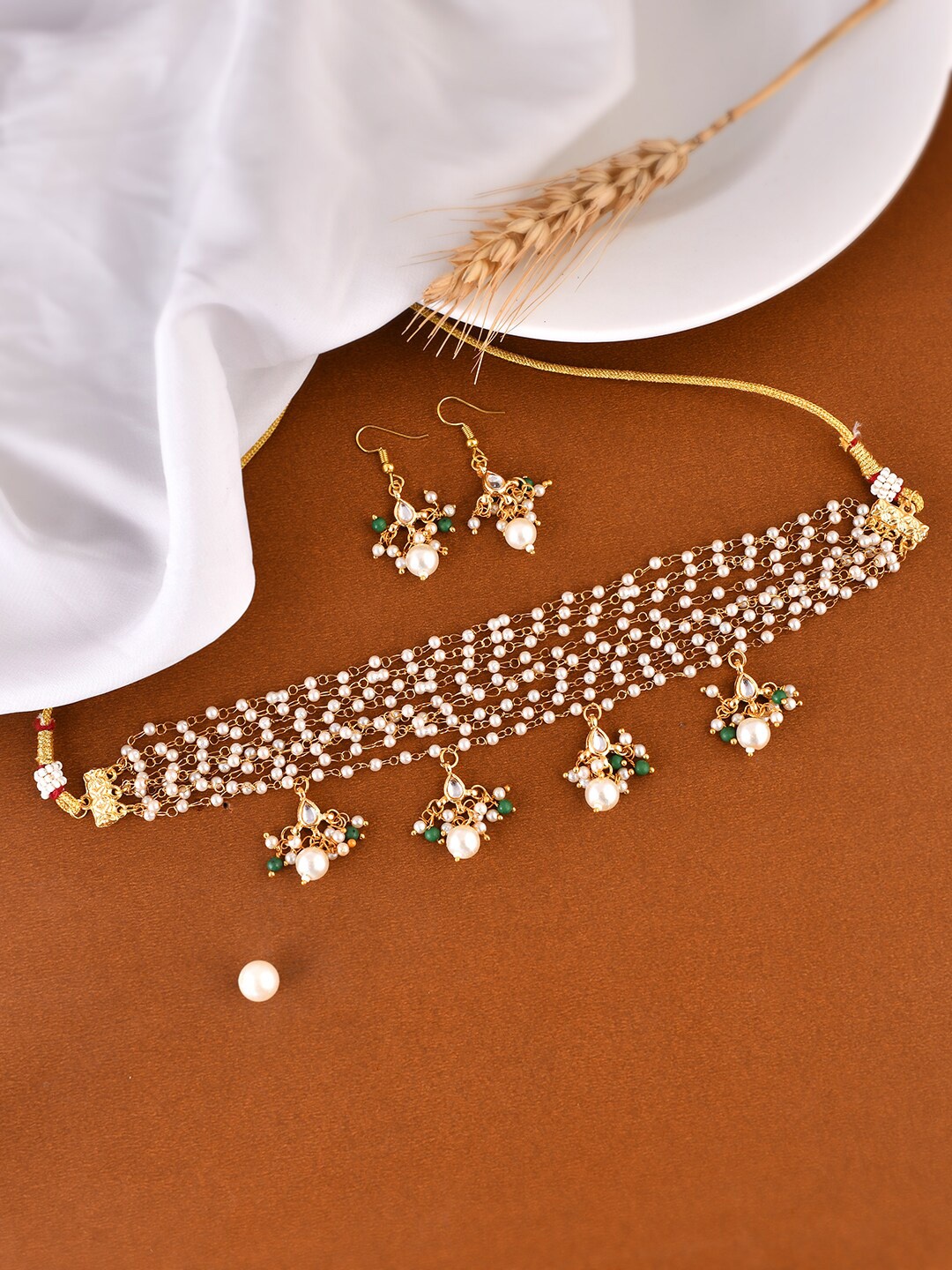 

Silvermerc Designs Gold Plated Stones Studded & Beaded Jewellery Set