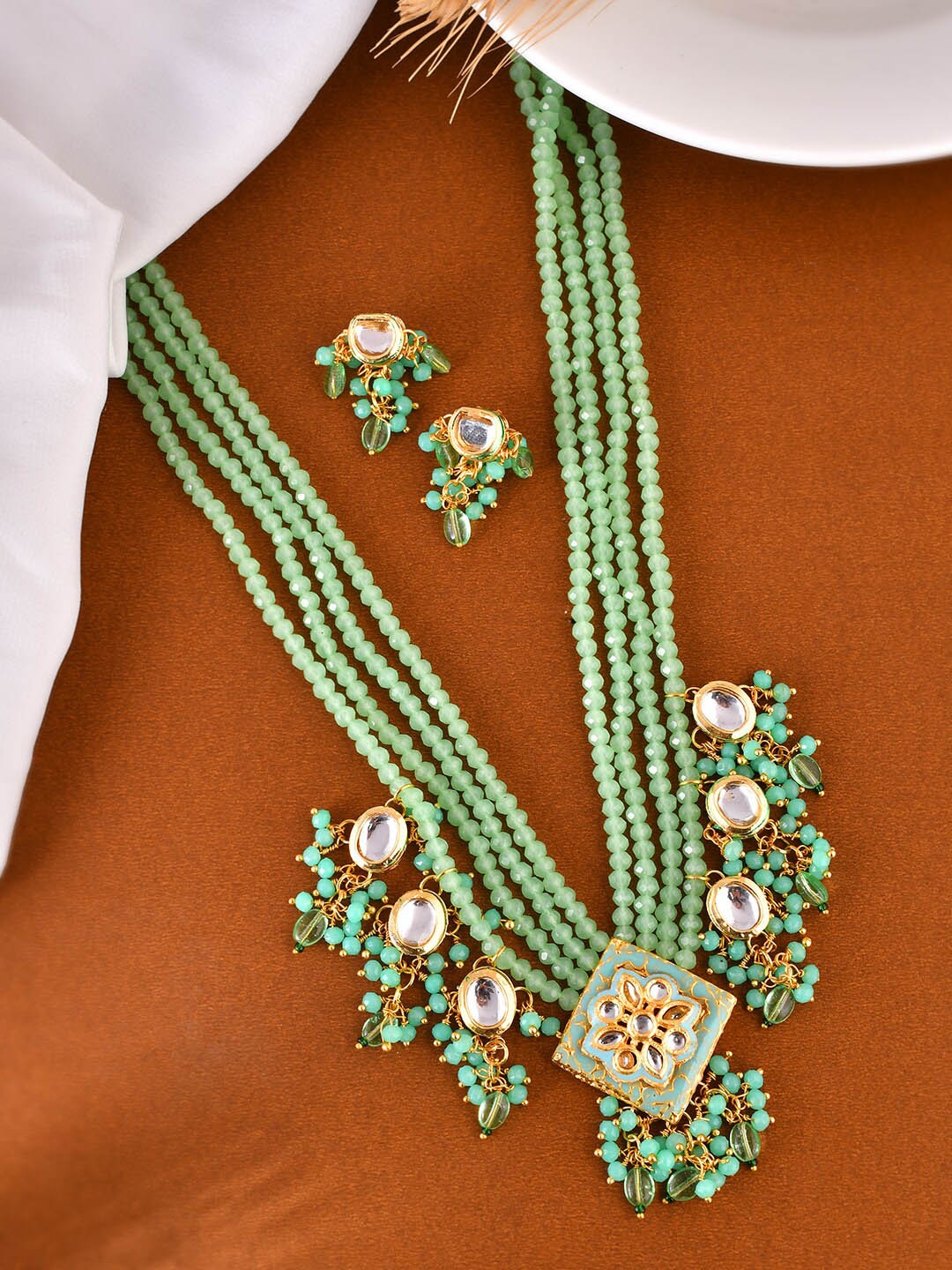 

Silvermerc Designs Gold Plated Stones Studded & Beaded Jewellery Set