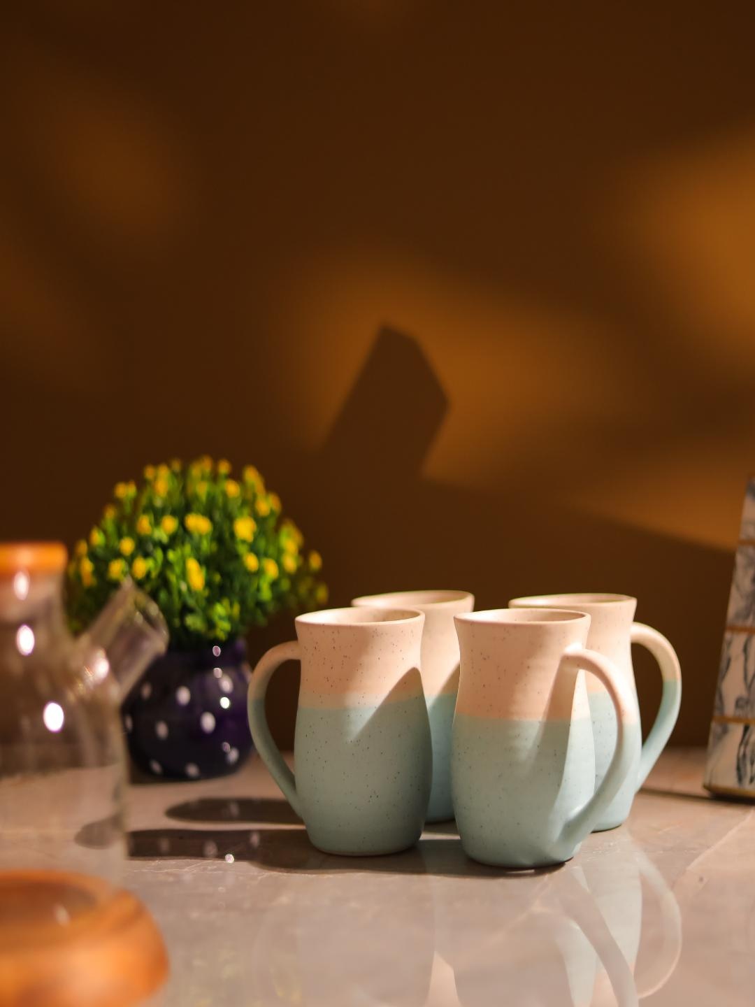 

The Decor Mart 4 Pieces White & Blue Printed Ceramic Glossy Mugs 400ml Each