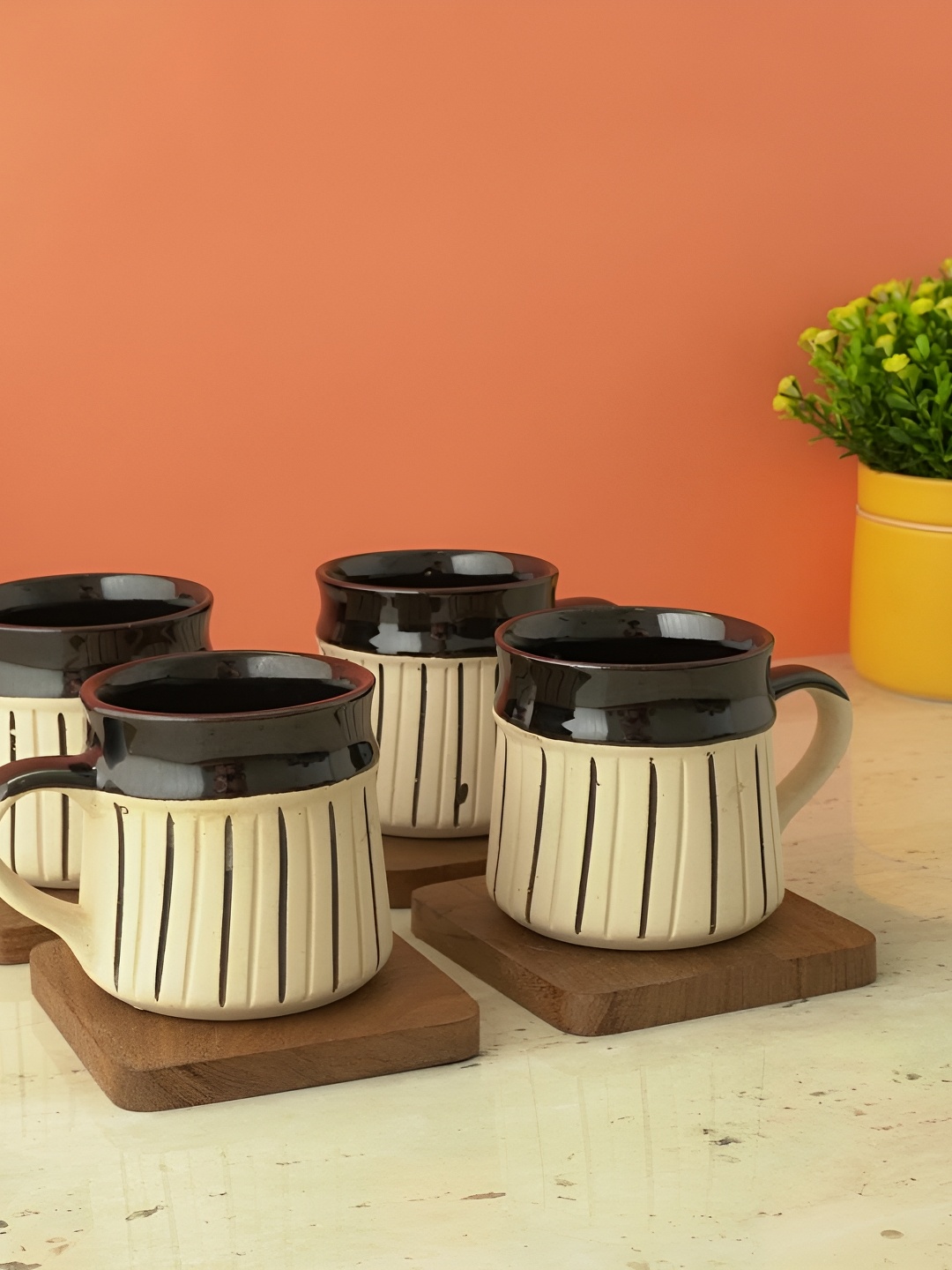 

The Decor Mart White & Black 4 Pieces Textured Ceramic Glossy Mugs 200ml Each