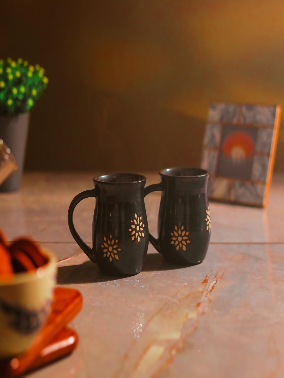 

The Decor Mart Black & Gold Toned 2 Pieces Printed Ceramic Glossy Mugs