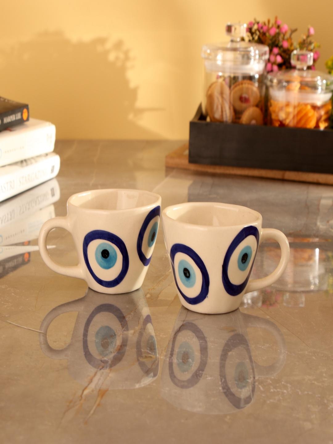 

The Decor Mart White & Blue 2 Pieces Printed Ceramic Glossy Mugs 300 ml Each