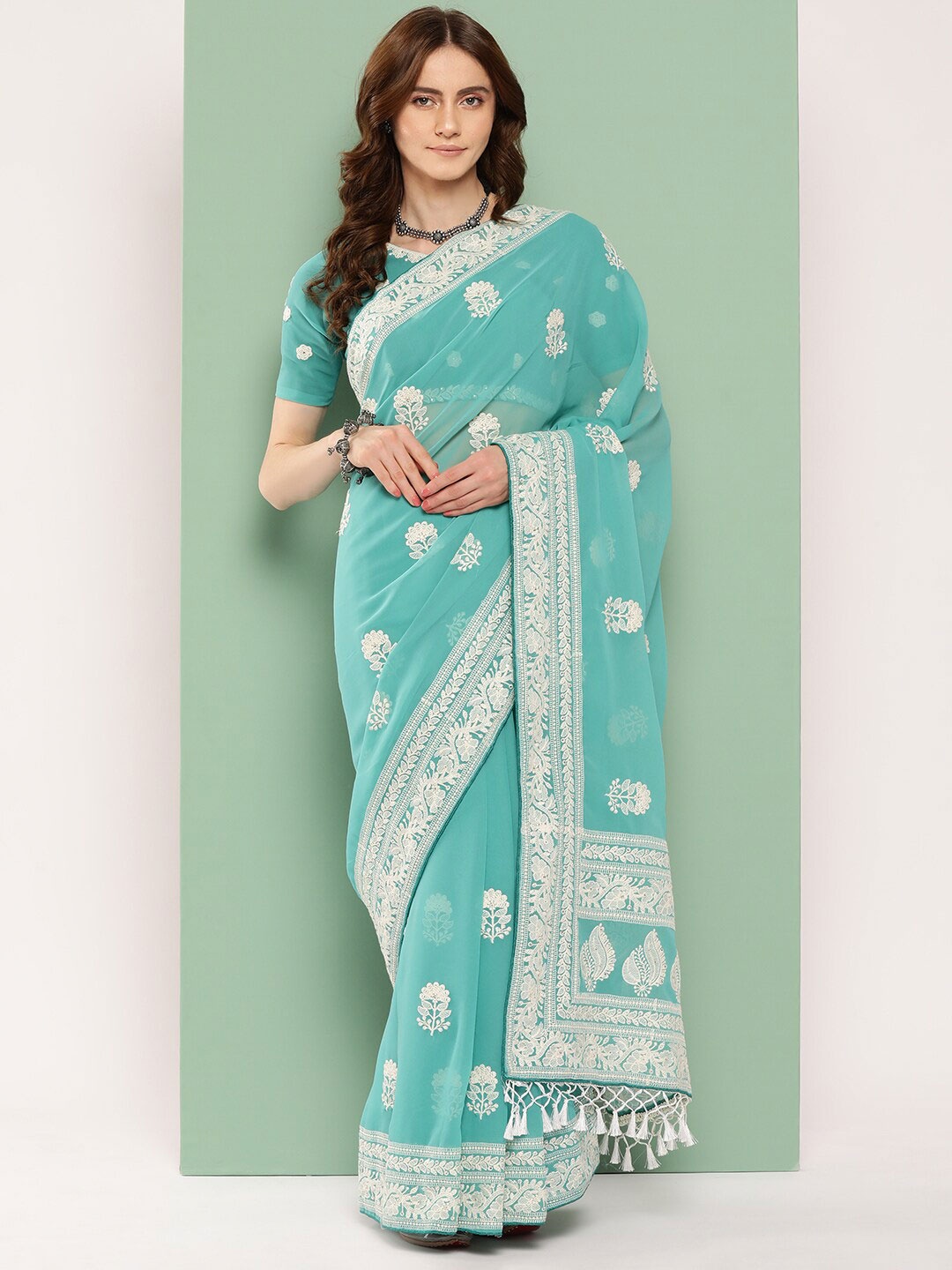 

Shaily Turquoise Blue Floral Chikankari Embroidered Pure Georgette Saree