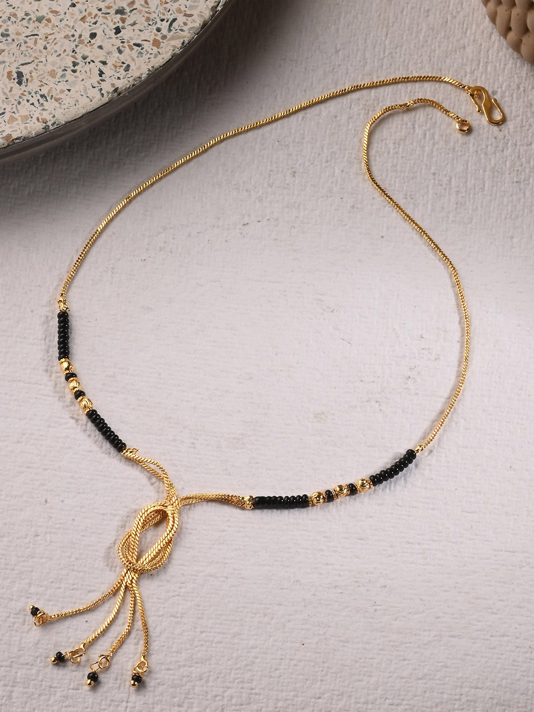 

AanyaCentric Gold-Plated Beads Beaded Mangalsutra With Finger Ring