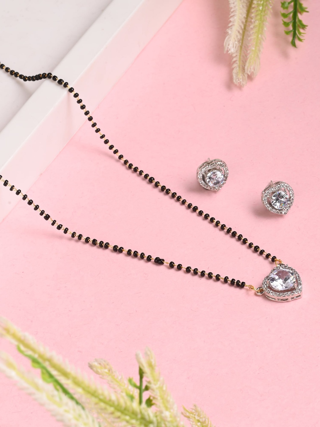 

AanyaCentric Gold-Plated Mangalsutra Pendant Earring Set & Silver Plated Anklets