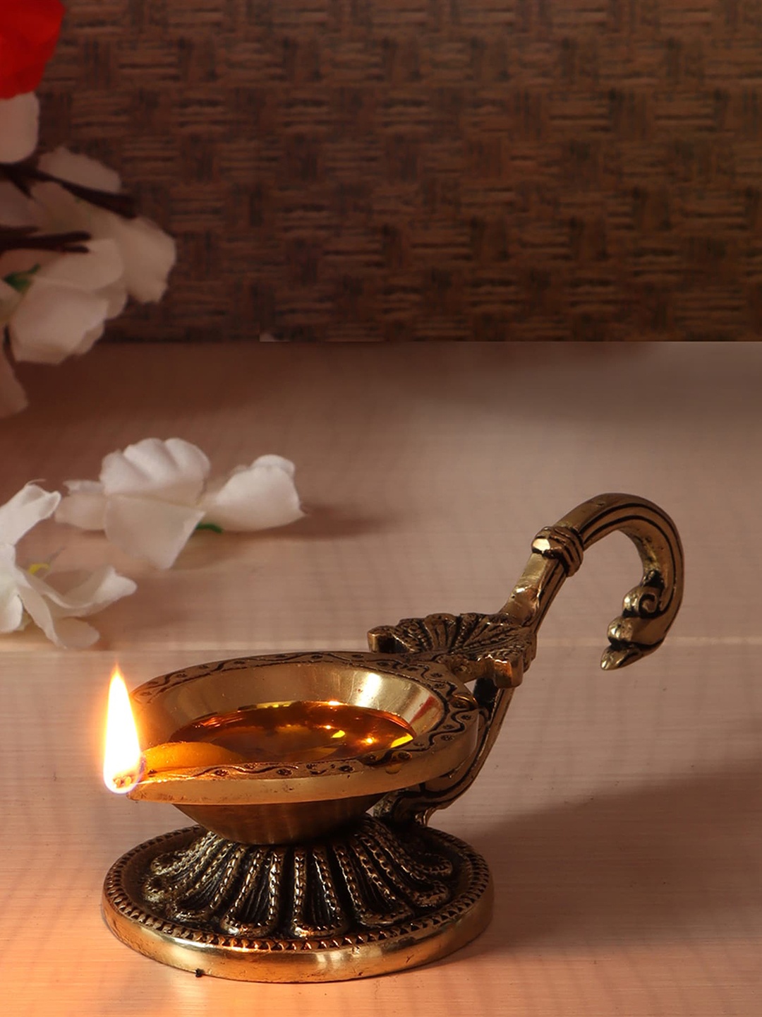 

Two Moustaches Brass Diya with Curved Handle, Gold