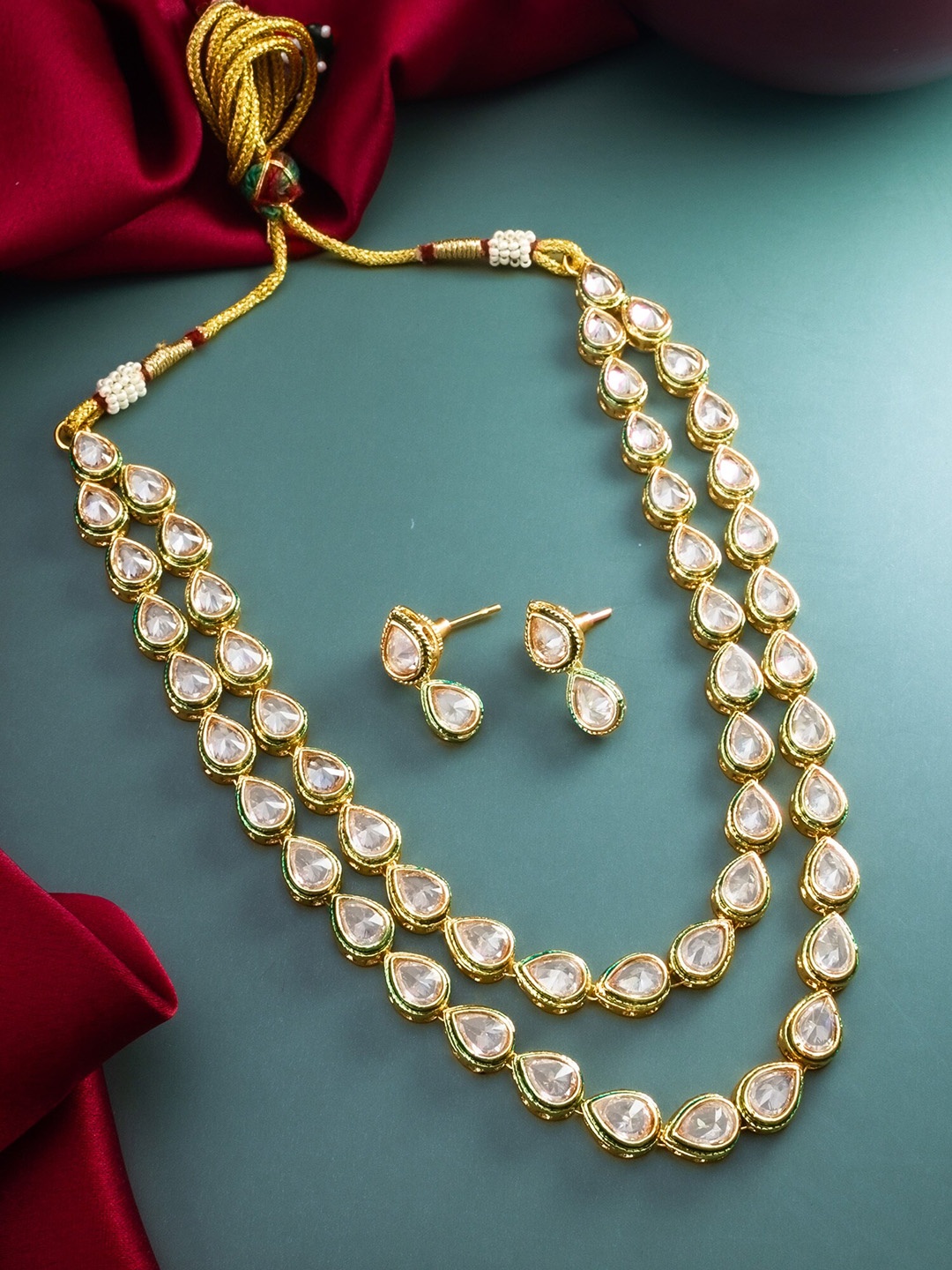 

aadita Gold Plated Stones Studded Jewellery Set
