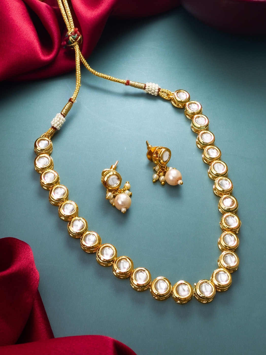 

aadita Gold Plated Stones Studded Jewellery Set