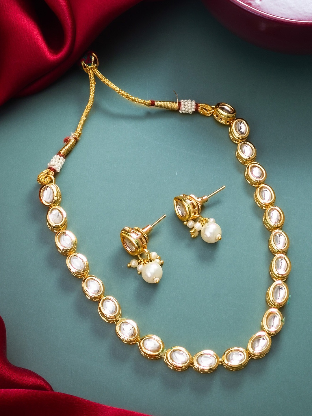 

aadita Gold Plated Stones Studded Jewellery Set