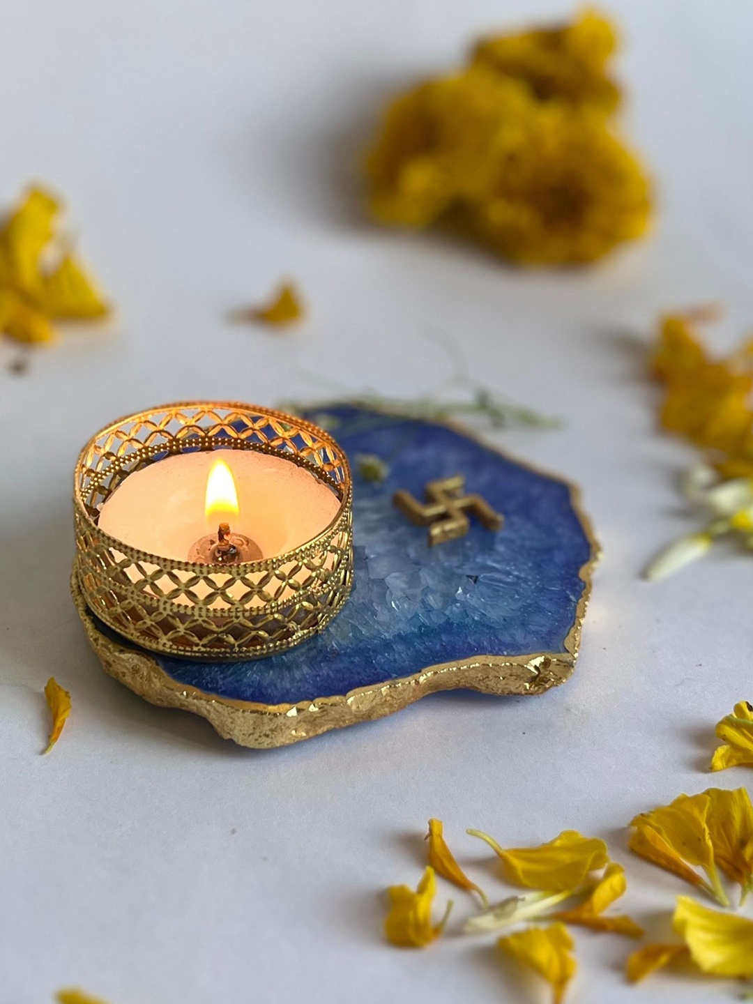 

HOMEARTE Blue Swastik Tea Light Candle Holder