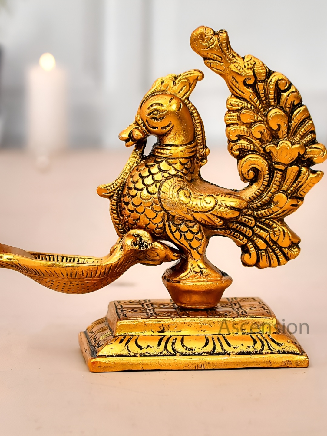 

Ascension Gold Toned Metal Peacock Deepak Figurine Showpiece