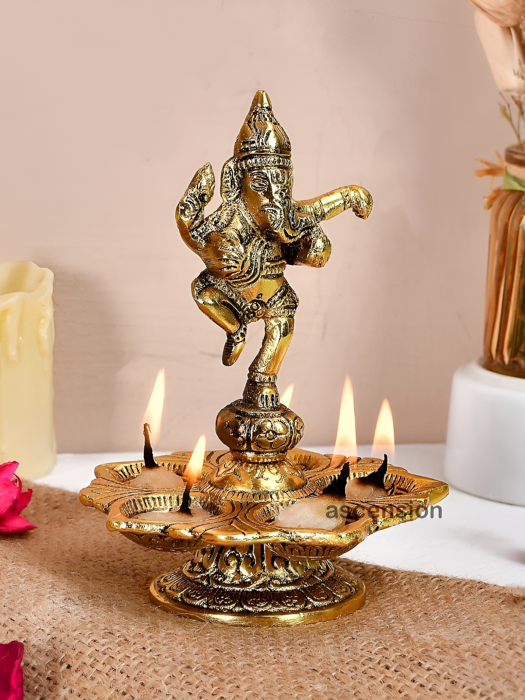 

Ascension Gold Toned Metal Dancing Ganesh Diya with Wick Holder & Stand
